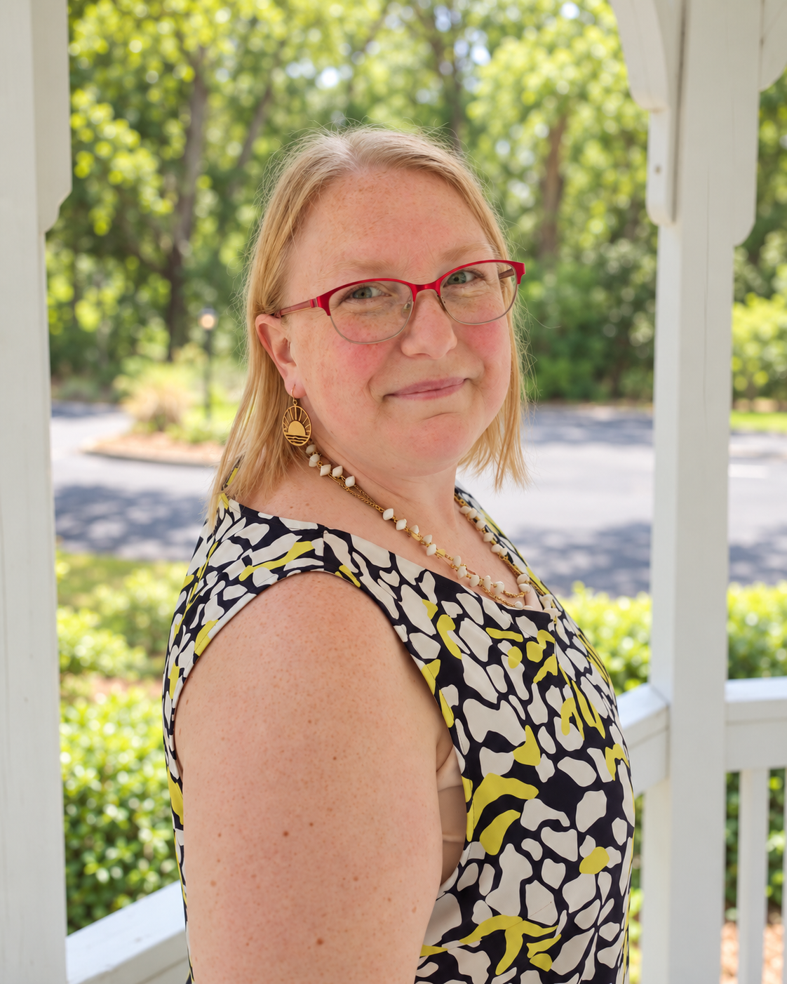 Ashley Bryant outdoors in a garden gazebo